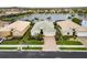 Aerial view of a home with mature landscaping and brick driveway at 2183 Nettlebush Ln, Venice, FL 34292