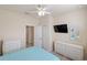 Nicely decorated bedroom features ceiling fan and lots of storage at 2183 Nettlebush Ln, Venice, FL 34292
