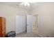 Bedroom with neutral walls and carpet, and a white closet with double folding doors at 2183 Nettlebush Ln, Venice, FL 34292