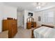 Spacious bedroom featuring a vanity, a window with shutters, and neutral carpeting, creating a relaxing atmosphere at 2183 Nettlebush Ln, Venice, FL 34292