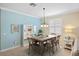 Bright dining room with a stylish light fixture, a window, and room to host Gathering meals at 2183 Nettlebush Ln, Venice, FL 34292