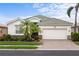 Charming single-story home featuring a well-maintained lawn, tile roof and a two-car garage at 2183 Nettlebush Ln, Venice, FL 34292