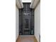 Close-up of the front door with security screen for added peace of mind at 2183 Nettlebush Ln, Venice, FL 34292