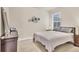 Inviting bedroom with a comfortable bed, large window, and simple, clean decor, creating a relaxing atmosphere at 2756 Canoe Ln, North Port, FL 34286