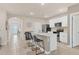 Modern kitchen featuring stainless steel appliances, white cabinetry, and a center island with bar seating at 2756 Canoe Ln, North Port, FL 34286