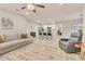 Spacious open concept living room with tile floors seamlessly connected to the modern kitchen at 2756 Canoe Ln, North Port, FL 34286