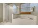 Bathroom featuring a shower stall and soaking tub with a tile surround at 315 Londonderry Dr, Sarasota, FL 34240