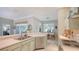 Well-lit kitchen with stainless steel appliances and a view into the dining area at 315 Londonderry Dr, Sarasota, FL 34240