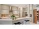 Modern kitchen with white countertops, stainless steel appliances, and a breakfast bar overlooking the living area at 315 Londonderry Dr, Sarasota, FL 34240