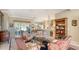 Inviting living room featuring elegant furnishings, neutral tones, and a seamless flow into the kitchen at 315 Londonderry Dr, Sarasota, FL 34240