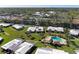 Overhead view of homes near a pool, showcasing the beautiful landscaping and convenient location at 3259 Fairhaven Ln # 211, Sarasota, FL 34239