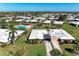 Expansive aerial view of a single-story home with community pool and palm tree landscaping at 3259 Fairhaven Ln # 211, Sarasota, FL 34239