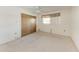 Bright bedroom with neutral carpet, ceiling fan, and closet at 3259 Fairhaven Ln # 211, Sarasota, FL 34239