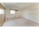 A simple bedroom offers neutral carpeting, a ceiling fan, and a cozy atmosphere at 3259 Fairhaven Ln # 211, Sarasota, FL 34239
