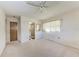This neutral bedroom has a ceiling fan, closet access, and an ensuite bathroom with a shower at 3259 Fairhaven Ln # 211, Sarasota, FL 34239