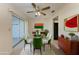 The dining room has a ceiling fan, a glass table, and sliding glass doors at 3259 Fairhaven Ln # 211, Sarasota, FL 34239