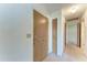 Hallway with carpet and neutral colored doors at 3259 Fairhaven Ln # 211, Sarasota, FL 34239
