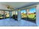 Enclosed lanai offers ample space and views of the community landscape through large windows, perfect for enjoying the outdoors at 3259 Fairhaven Ln # 211, Sarasota, FL 34239