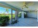 Enclosed lanai offers ample space and views of the community landscape through large windows, perfect for enjoying the outdoors at 3259 Fairhaven Ln # 211, Sarasota, FL 34239