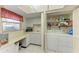 The laundry room has a folding table, washer, and dryer, all situated next to a closet at 3259 Fairhaven Ln # 211, Sarasota, FL 34239