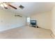 The carpeted living room has a ceiling fan and a wall-mounted coat rack at 3259 Fairhaven Ln # 211, Sarasota, FL 34239