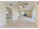 Inviting living room featuring an open floor plan, ceiling fan, and neutral color palette at 3259 Fairhaven Ln # 211, Sarasota, FL 34239