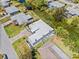 Aerial view of home with a well-manicured lawn and water views at 3319 Mayflower St, Sarasota, FL 34231