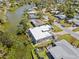 Stunning aerial view of a home on the water, featuring a modern design and lush landscaping at 3319 Mayflower St, Sarasota, FL 34231