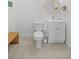 Bathroom with tiled floors, a toilet, sink, vanity, modern mirror and bench at 3319 Mayflower St, Sarasota, FL 34231