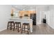 Bright kitchen with modern appliances, wood cabinets and breakfast bar at 3319 Mayflower St, Sarasota, FL 34231