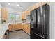 The open kitchen features modern appliances, wood cabinets, and ample counter space at 3319 Mayflower St, Sarasota, FL 34231