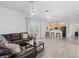 Spacious living room features an open concept design, gray laminate floors and backyard access at 3319 Mayflower St, Sarasota, FL 34231