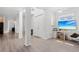 Bright, open living space with wood floors, natural lighting, and modern ceiling fan at 3319 Mayflower St, Sarasota, FL 34231