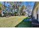 Backyard is spacious with a grill and some chairs at 3514 14Th E Ct, Ellenton, FL 34222