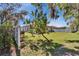 Backyard view features a tree, grill, and fence enclosing the property at 3514 14Th E Ct, Ellenton, FL 34222