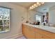 Bathroom featuring double vanity sinks and vanity drawers, and natural light at 3514 14Th E Ct, Ellenton, FL 34222