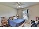 Bedroom with a ceiling fan, a window, and a chair at 3514 14Th E Ct, Ellenton, FL 34222