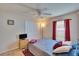 Bedroom features a ceiling fan and window that offers natural light at 3514 14Th E Ct, Ellenton, FL 34222