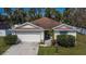 Charming single-story home featuring a well-maintained lawn and attached two-car garage at 3514 14Th E Ct, Ellenton, FL 34222