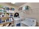 Laundry room featuring a washer, dryer, and shelves for storage and organization at 3514 14Th E Ct, Ellenton, FL 34222