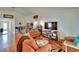 Comfortable living room with large tv and a cozy seating arrangement at 3514 14Th E Ct, Ellenton, FL 34222