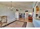 Open-concept living room with beautiful chandelier and natural light at 3514 14Th E Ct, Ellenton, FL 34222