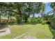 Expansive backyard featuring a playhouse and a new privacy fence at 3561 Elfers Pkwy, New Port Richey, FL 34655