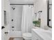 Clean bathroom with updated vanity, shower-tub combo, and modern fixtures at 3561 Elfers Pkwy, New Port Richey, FL 34655