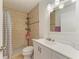 This bathroom has a tiled shower with modern fixtures and a bright vanity area at 3717 Delta St # 95, Sarasota, FL 34232