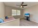 This bedroom features laminate flooring, neutral walls, and a modern ceiling fan at 3717 Delta St # 95, Sarasota, FL 34232