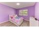 Bedroom featuring bright colors, a window, and charming decor at 3717 Delta St # 95, Sarasota, FL 34232