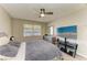Bedroom featuring a ceiling fan, window, dresser, and stylish decor at 3717 Delta St # 95, Sarasota, FL 34232