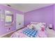 Bedroom with bright walls, a mirror, closet, and a well-decorated bed at 3717 Delta St # 95, Sarasota, FL 34232