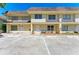 Charming townhome featuring a well-manicured lawn, outdoor seating, and ample parking space at 3717 Delta St # 95, Sarasota, FL 34232